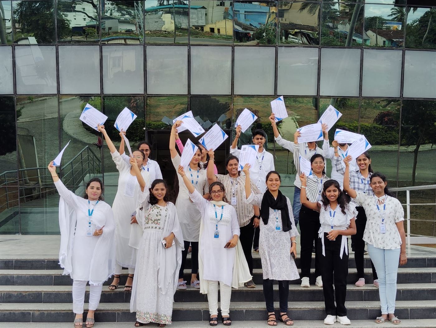 Interns celebrating with their certificates