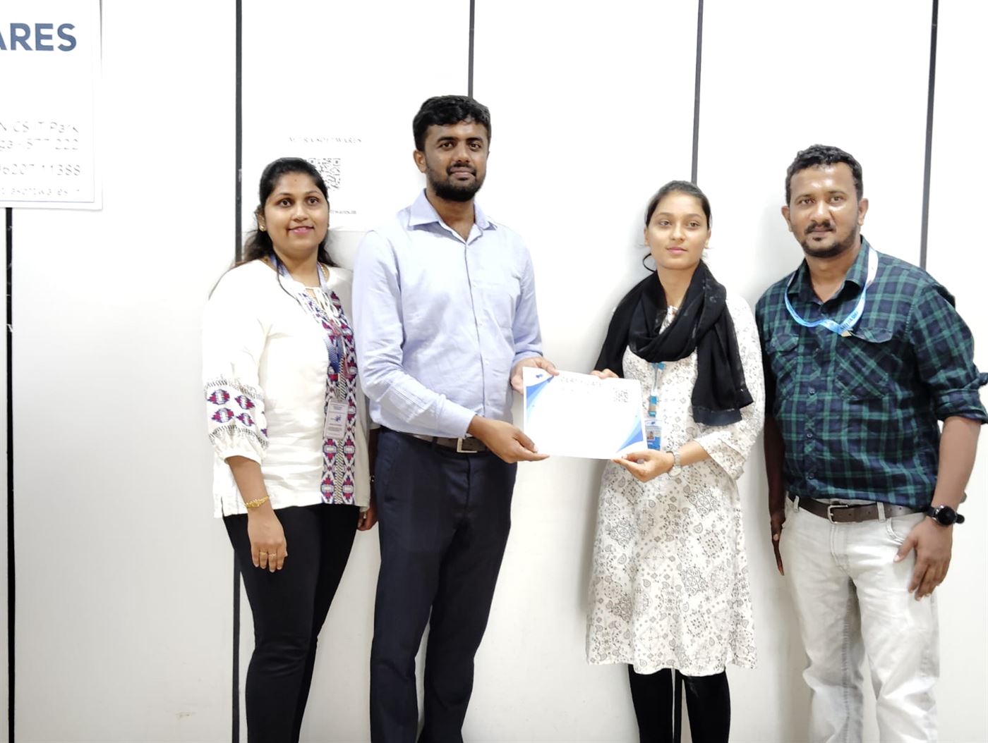 Intern receiving a completion certificate
