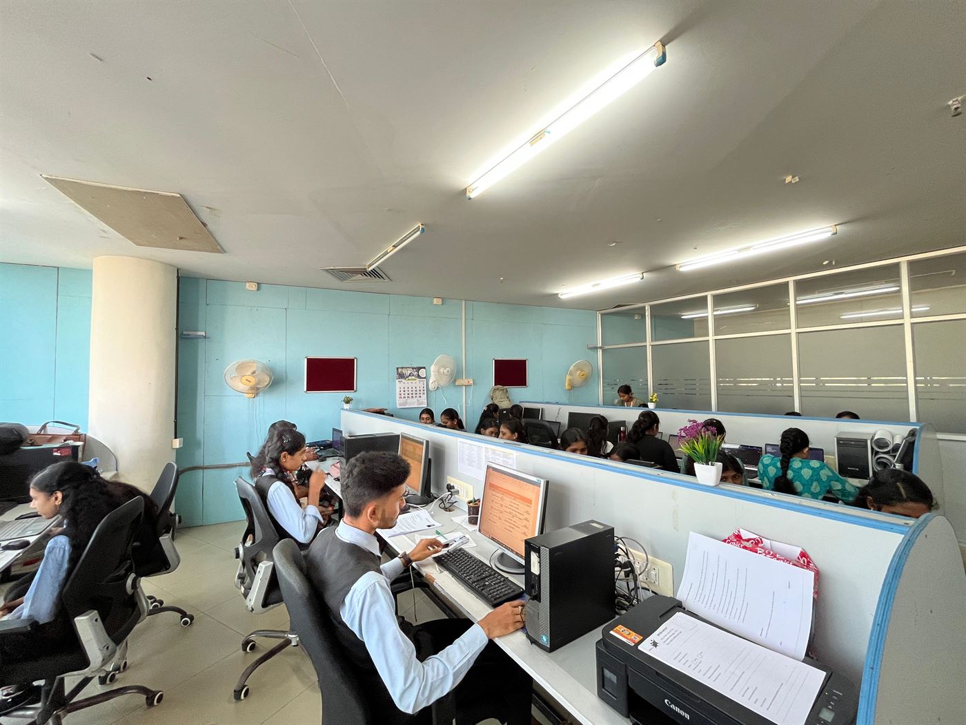Interns at their workstations
