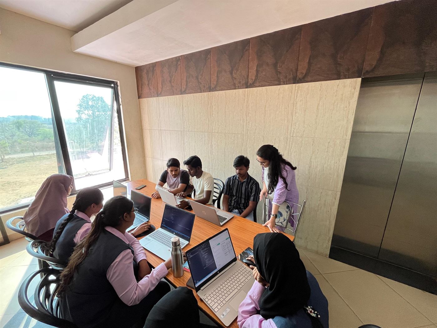 Interns at a group workstation