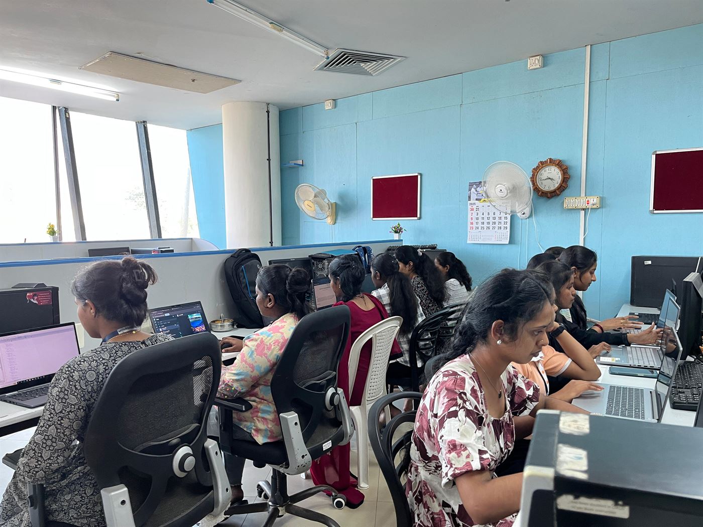 Interns focused on their screens