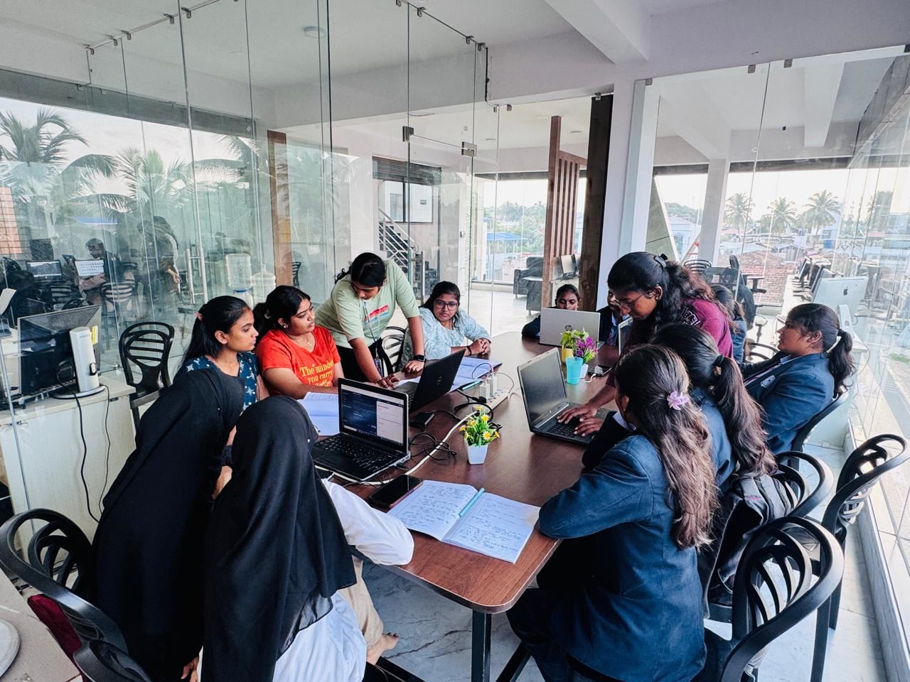 The team planning together around a table